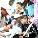 Rory McIlroy signs autographs for fans following the Pro-Am of the RBC Canadian Open at Oakdale Golf and Country Club