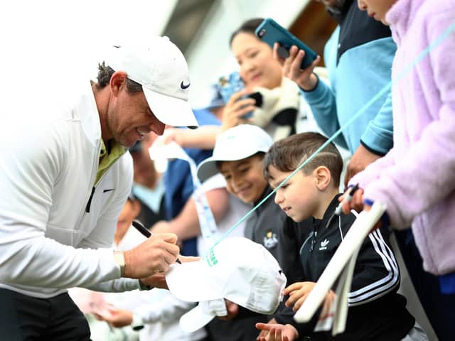 Rory McIlroy signs autographs for fans following the Pro-Am of the RBC Canadian Open at Oakdale Golf and Country Club