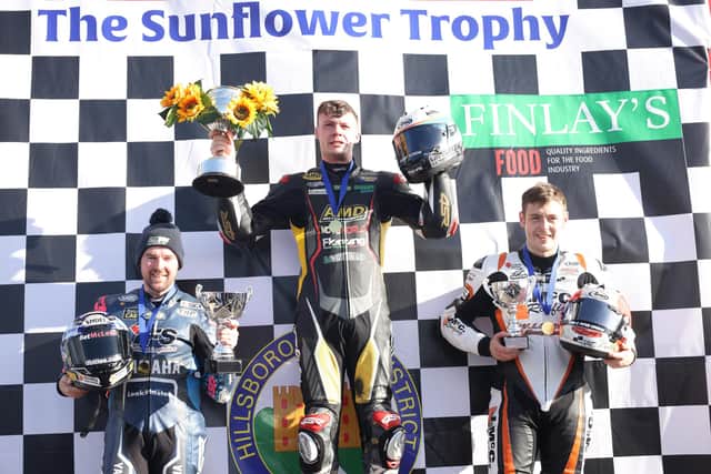 Richard Kerr on the podium after winning the Sunflower Trophy race on the AMD Motorsport Honda with runner-up Alastair Seeley (left) and Jason Lynn. Picture: Stephen Davison