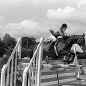 Pictured in July 1980 at the Killinchy Show is Anna Erskine on Windy on her way to a clear round. Picture: News Letter archives/Darryl Armitage