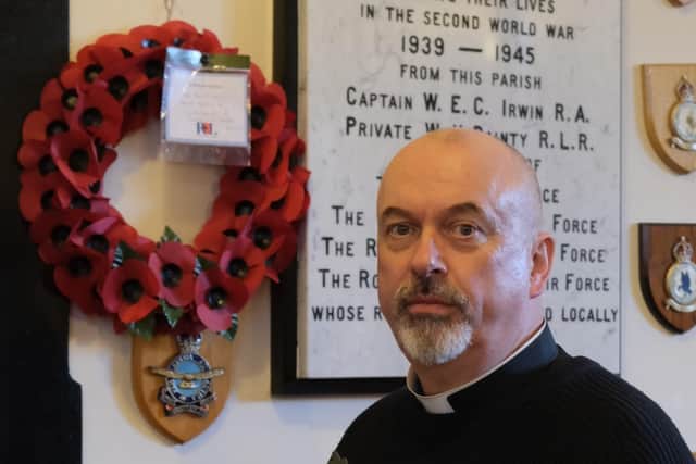 Archdeacon Paul Thompson, rector of Derryvullan North parish church, Irvinestown with the special poppy made from medal from a crashed Catalina Flying Boat, which will be on display on Remembrance Sunday