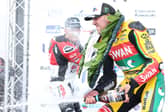 Peter Hickman sprays the champagne on the podium after winning the second Supertwin race for a double on the Swan Yamaha