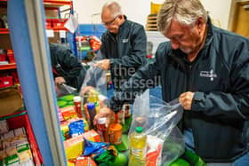 New figures from the Trussell Trust reveal that the charity’s Northern Ireland network of food banks distributed a record number of emergency food parcels between April and September this year – more than ever before for this six-month period and the largest increase in the UK. Pictured are volunteers at Carrickfergus food bank and warehouse sorting food and other items into bags for collection