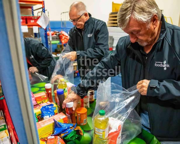 New figures from the Trussell Trust reveal that the charity’s Northern Ireland network of food banks distributed a record number of emergency food parcels between April and September this year – more than ever before for this six-month period and the largest increase in the UK. Pictured are volunteers at Carrickfergus food bank and warehouse sorting food and other items into bags for collection