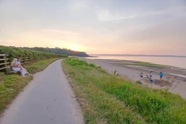 People enjoy the last of the sunshine at Crawfordsburn beach at 9.30pm on Thursday July 16