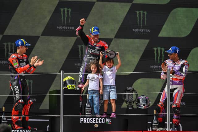 Aleix Espargaro celebrates his win at the Catalan MotoGP with his kids, plus Maverick Vinales and Jorge Martin.