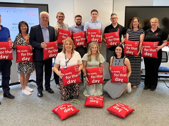 The British Heart Foundation Northern Ireland have teamed up with Heron Bros. in an initiative which saw them become the first construction firm in Northern Ireland to deliver lifesaving CPR training to its employees.  pictured are staff from Heron Bros at the recent CPR training session in Draperstown. Included, are head of BHFNI Fearghal McKinney and Caroline Hughes, Heron Bros