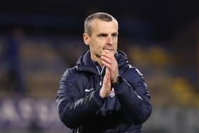 Coleraine manager Oran Kearney applauds the crowd after the Bannsiders' 3-0 win against Linfield
