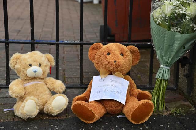Flowers and Teddy Bears at the scene of the incident. Picture By: Arthur Allison/Pacemaker Press.