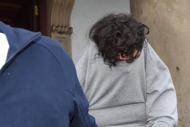 File photo from 2018 of Daniel Allen being led away from Enniskillen Magistrates' Court, with his sweatshirt over his head. He has been found responsible for the deaths of four people following a house fire, and has been sentenced to 29 years in prison. Photo: PA Wire