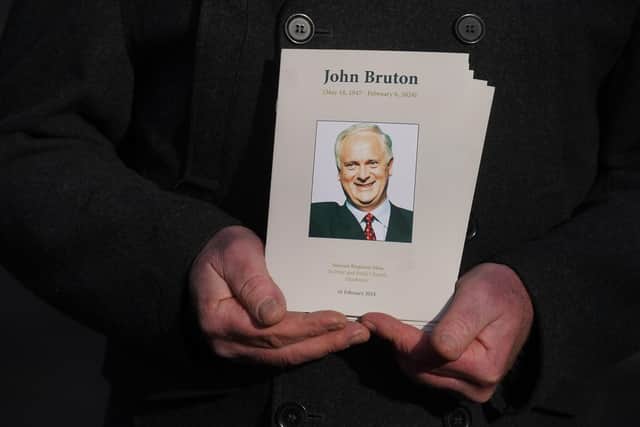 A man holds an order of service at the state funeral of former taoiseach John Bruton at Saints Peter's and Paul's Church in Dunboyne, Co Meath. Photo: Brian Lawless/PA Wire