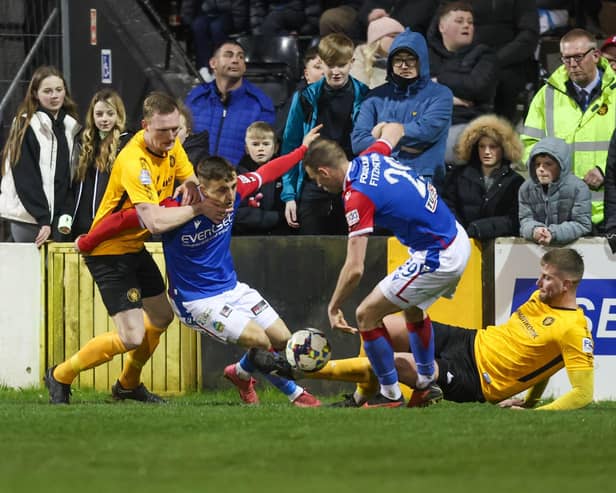 Carrick Rangers and Linfield players battle for control in a five-goal thriller which left the latter side out on top by 3-2. (Photo by Matt Mackey/PressEye)