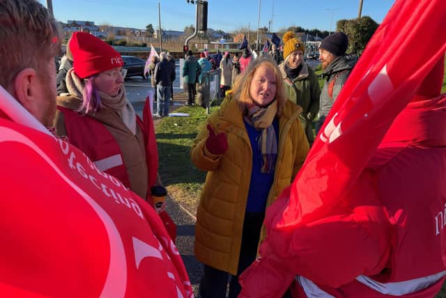 Alliance Party leader Naomi Long (right) speaks to workers on the picket line outside the Ulster Hospital in Dundonald, as an estimated 150,000 workers take part in walkouts over pay across Northern Ireland.
