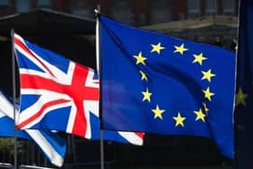 A UK flag next to an EU one