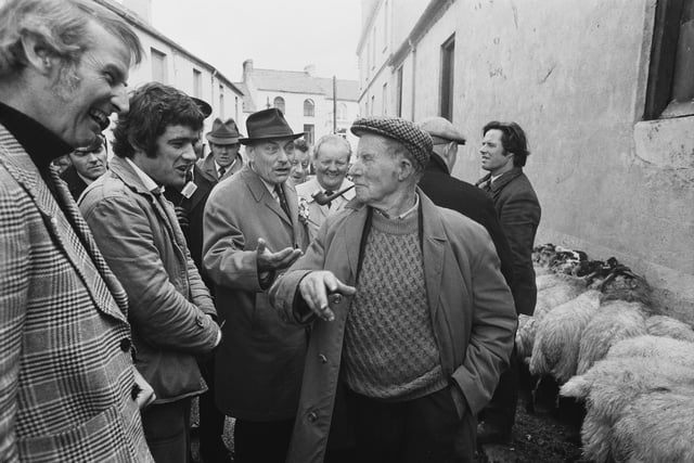 Enoch Powell (1912-1998) speaking with local residents while campaigning for the Ulster Unionist Party (UUP) for the South Down constituency, County Down, Northern Ireland, 6th October 1974. Powell won the seat, receiving over 50% of the vote (33, 614 votes). (Photo by Jack Kay/Express/Hulton Archive/Getty Images)