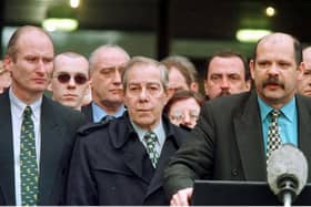 PUP leader David Ervine (right) after the Belfast Agreement signing on April 10 1998, with party colleagues Hugh Smyth (centre) and Billy Hutchison (left) and other loyalists. Billy Hutchinson says: "When the media asked, 'What is your mandate?' I replied, 'The silence of the guns'." Photo: Brian Little/PA Wire