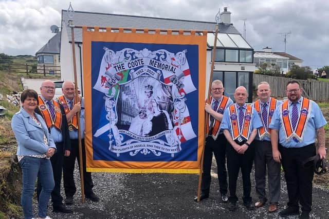 Arlene Foster with members of The Coote Memorial lodge with their new banner in Donegal