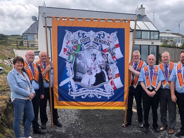 Arlene Foster with members of The Coote Memorial lodge with their new banner in Donegal