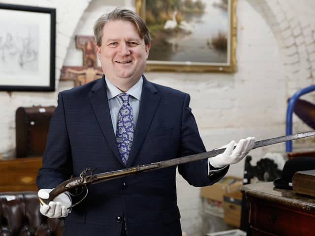 Bloomfield Auctions Managing Director Karl Bennett with a sword pistol linked to the 1689 Siege of Derry
