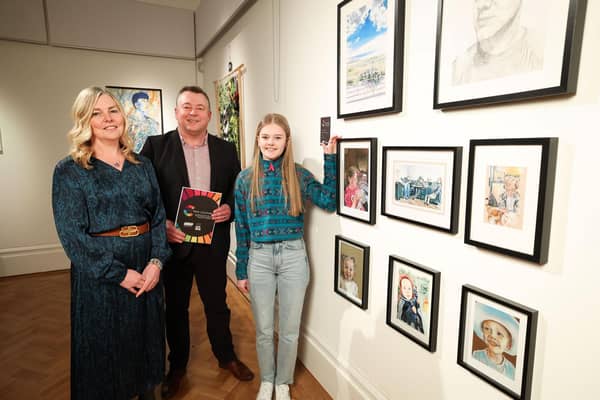CCEA’s Art and Design Education Manager, Anne McGinn congratulates young artist Leah Massey on their artwork, along with Principal Gary Greer (from Bloomfield Collegiate School) at the exhibition launch