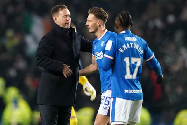 Rangers manager Michael Beale and Ben Davies celebrate after beating Hibernian 3-2