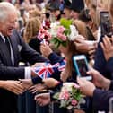 Britain's King Charles III and Britain's Camilla, Queen Consort greet wellwishers as they arrive at Hillsborough Castle in Belfast on September 13, 2022, during his visit to Northern Ireland