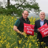 Former Ulster and Ireland rugby star and Co Armagh arable farmer Simon Best is teaming up with the British Heart Foundation NI at the Balmoral Show to encourage his fellow farmers to be aware of their heart health. Pictured with Simon at his farm in Poyntzpass, Newry is Fearghal McKinney, head of BHF NI. Picture: Submitted