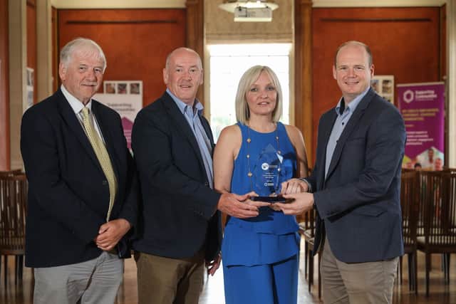 Presenting Choice Housing’s Michelle McAnespy and William Wilson with the Platinum Level Tenant Participation Award is Supporting Communities’ CEO Colm McDaid (second from left) and Department for Communities Minister Gordon Lyons MLA (R)