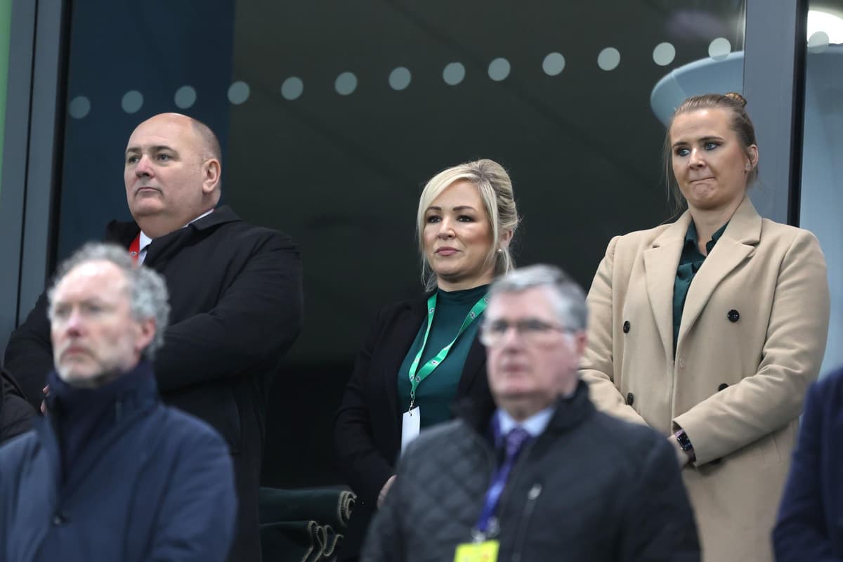 Michelle O'Neill stands for UK national anthem at her first Northern Ireland football match at Windsor Park