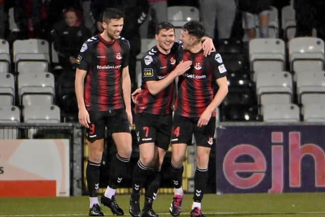 Philip Lowry (centre) added to his season's goal tally in victory for Crusaders over Coleraine