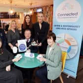 Attending the Connected Cafe Launch are (lL-R) Denise McClenaghan, NHSCT, Councillor Norrie Ramsey, Antrim and Newtownabbey Borough Council, Jamaine Woodside, Caffe 3, Leah Glass, NHSCT and Sophie McCorriston, Caffe 3. (Seated L-R )Valerie Adams, Chairperson of the Antrim and Newtownabbey Loneliness Network, Mayor of Antrim and Newtownabbey Borough Council, Alderman Stephen Ross and Councillor Noreen McClelland, Antrim and Newtownabbey Borough Council.