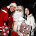 Young Emma Trainor was delighted to meet Santa and Mrs Claus, during a visit to their Grotto at the 'Chriistmas On The Hill' Celebrations in Rathfriland.