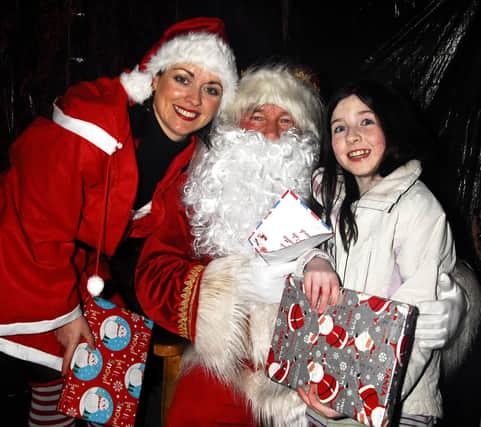 Young Emma Trainor was delighted to meet Santa and Mrs Claus, during a visit to their Grotto at the 'Chriistmas On The Hill' Celebrations in Rathfriland.