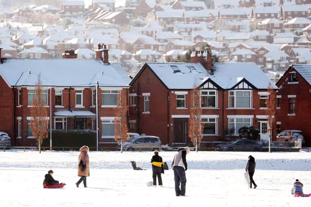 People enjoy the snow in Orangefield Park in east Belfast.