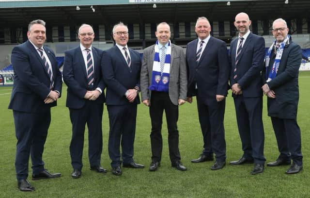 Secretary of State for Northern Ireland Chris Heaton-Harris (centre) during his April visit to Coleraine Football Club. (Photo by Coleraine FC)