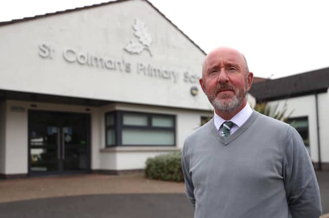 Principal Stephen Baine outside St Colman's Primary School in Lambeg, Co Antrim, which received a bomb threat. Liam McBurney/the Press Association