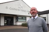 Principal Stephen Baine outside St Colman's Primary School in Lambeg, Co Antrim, which received a bomb threat. Liam McBurney/the Press Association