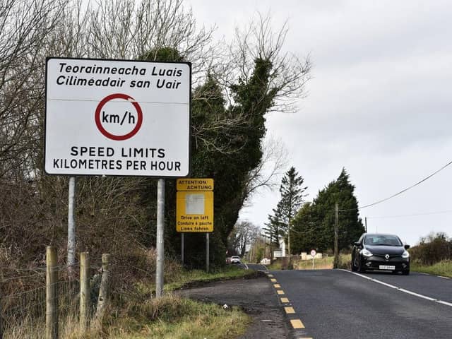 Road signs denote the border crossing in the village of Belleek