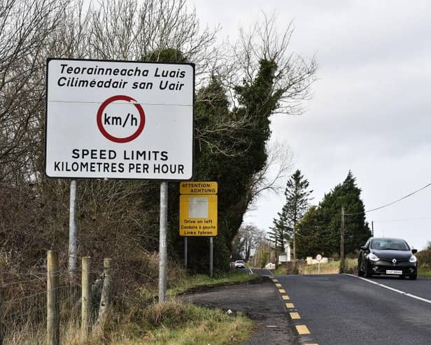 Road signs denote the border crossing in the village of Belleek