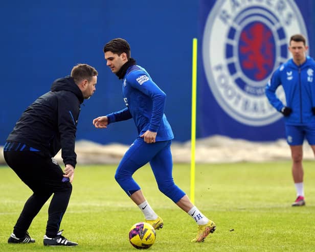 Rangers' Ianis Hagi with manager Michael Beale during a training session