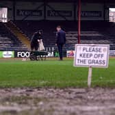 Ground staff worked on the pitch ahead of the cinch Premiership match between Dundee and Rangers at Dens Park before officials called the game off