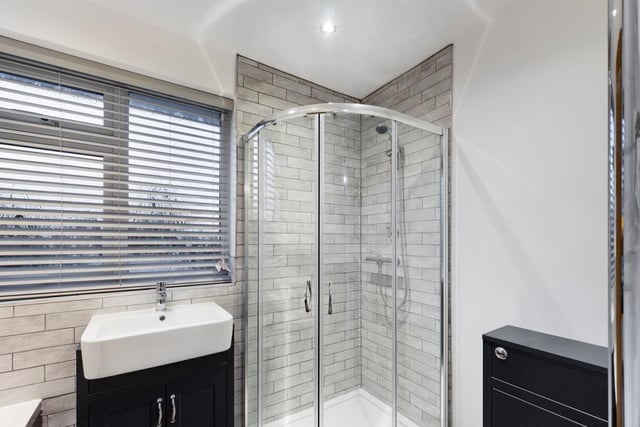 Newly refitted, the modern bathroom features a shower enclosure, with a thermostatic shower and glazed door. The vanity wash hand basin includes a storage cupboard underneath.