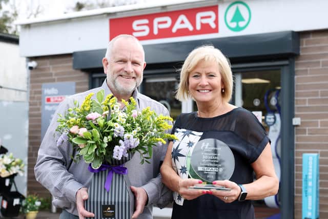 Tommy McIntyre, store owner and his wife, Patricia McIntyre, celebrating 30 years of McIntyre’s SPAR Martinstown in Ballymena