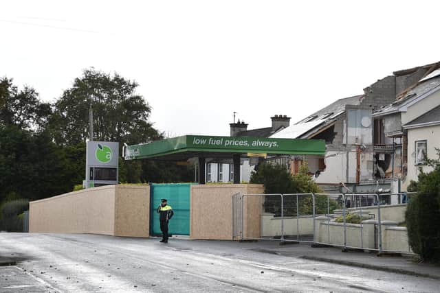 A Garda officer stands on duty at the scene of the Applegreen petrol station tragedy