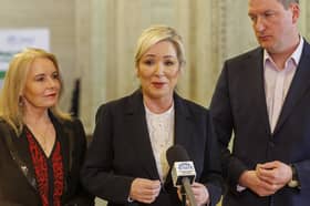 First Minister Michelle O'Neill (centre) with Sinn Fein party colleagues Pat Cullen and John Finucane speaking to the media during a press conference in The Great Hall of Parliament Buildings at Stormont, Belfast