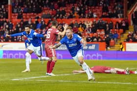 Rangers' Scott Arfield celebrates scoring the winning goal - his second injury-time finish last night in a dramatic 3-2 win over Aberdeen