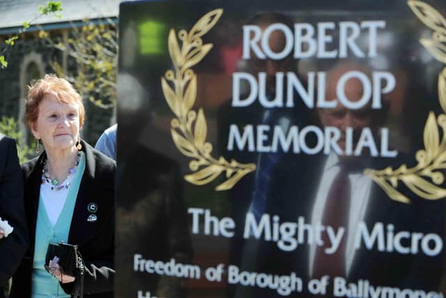 May Dunlop reads the inscriptions on her son Robert's memorial on the day it was unveiled in the Robert Dunlop Memorial Garden in Ballymoney during 2010.  
PICTURE BY STEPHEN DAVISON
