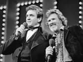 Country stars Johnny Cash, left and Kris Kristofferson sing during the Country Music Awards in Nashville, Tenn., Oct. 1983. Kristofferson, a Rhodes scholar with a deft writing style and rough charisma who became a country music superstar and A-list Hollywood actor, has died Saturday, Sept. 28, 2024. (AP Photo, File)