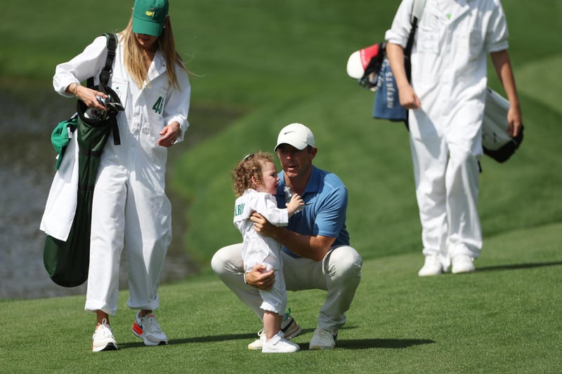 Rory McIlroy of Northern Ireland  looks on with his daughter Poppy McIlroy on the first hole during the Par 3 contest prior to the 2023 Masters Tournament at Augusta National Golf Club on April 05, 2023 in Augusta, Georgia. (Photo by Patrick Smith/Getty Images)