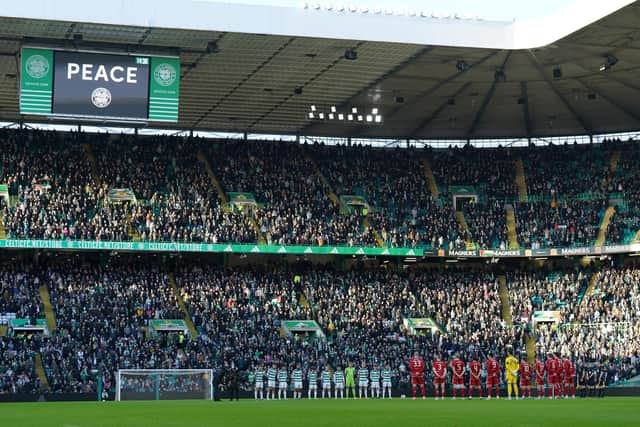 Celtic and Aberdeen players take part in a minute's silence for Remembrance Day during the cinch Premiership match at Celtic Park, Glasgow